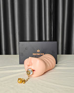 Wenwen Realistic Deep Throat Stroker three-quarter view with decorative accessory and product box