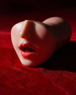 Wenwen Realistic Deep Throat Stroker front view on red fabric