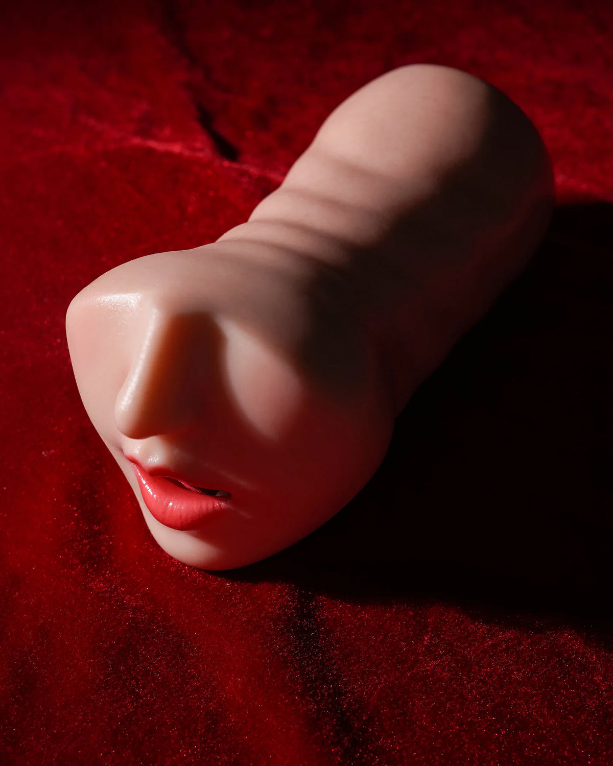Wenwen Realistic Deep Throat Stroker side profile on red fabric